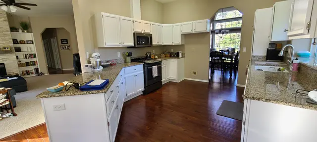 Kitchen cabinets refinished in white