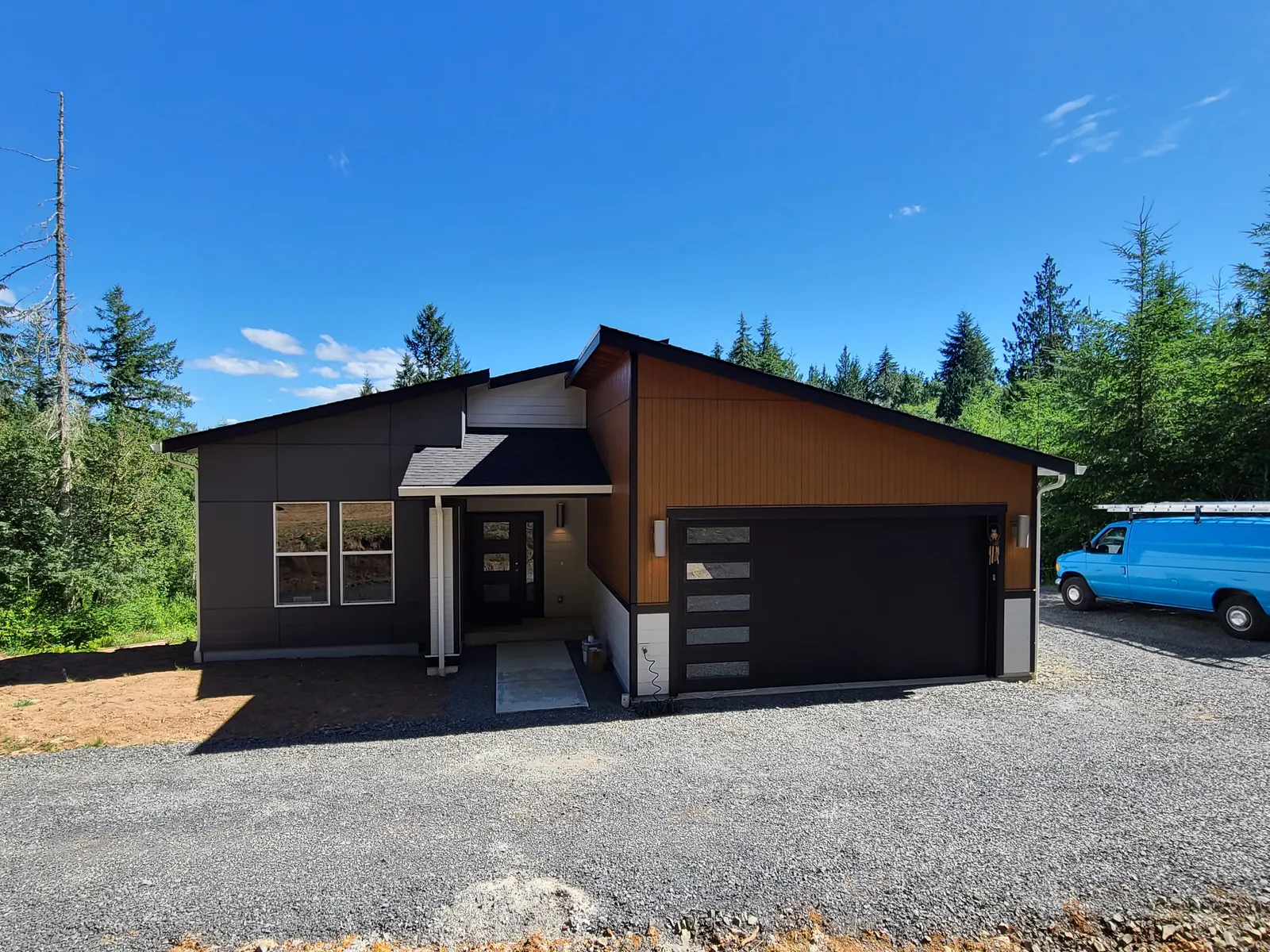 Freshly painted modern home with dark siding in Thurston County